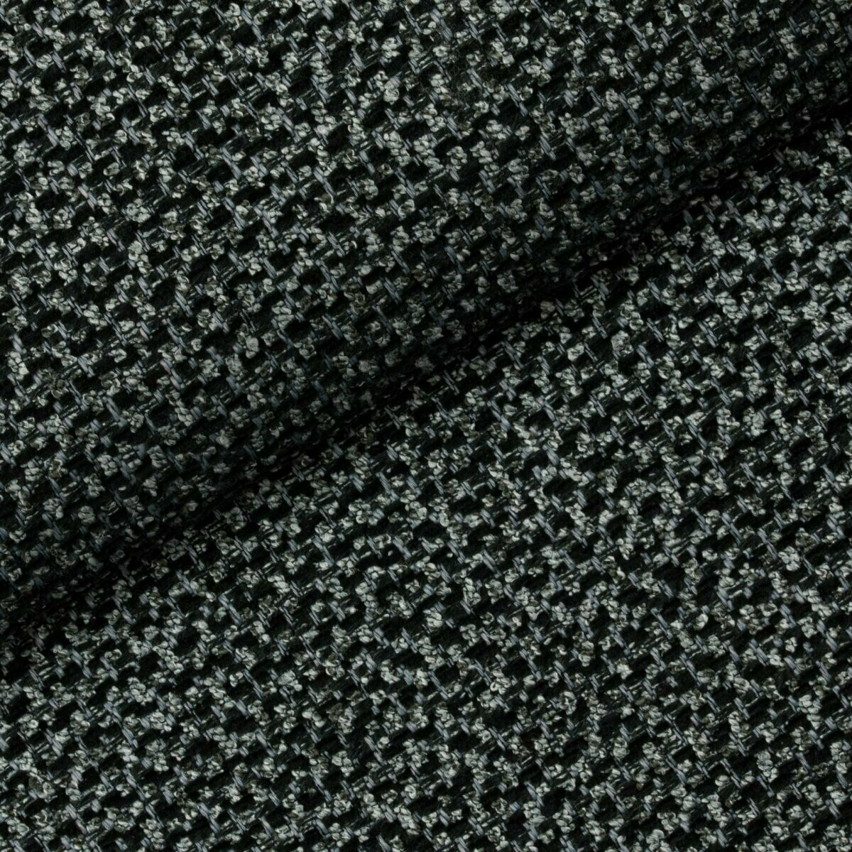 Niejednolita tkanina Nebbia 12 Fargotex w kolorze czarnym z szarymi elementami. Intrygująca struktura i głęboki kolor.
