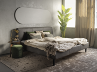 Szare łóżko tapicerowane z wygodnym wezgłowiem