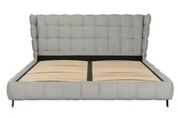 Szare łóżko z dużym, pikowanym zagłówkiem